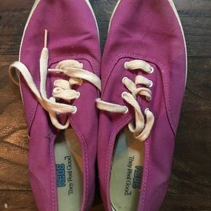 Woman’s purple/pink keds